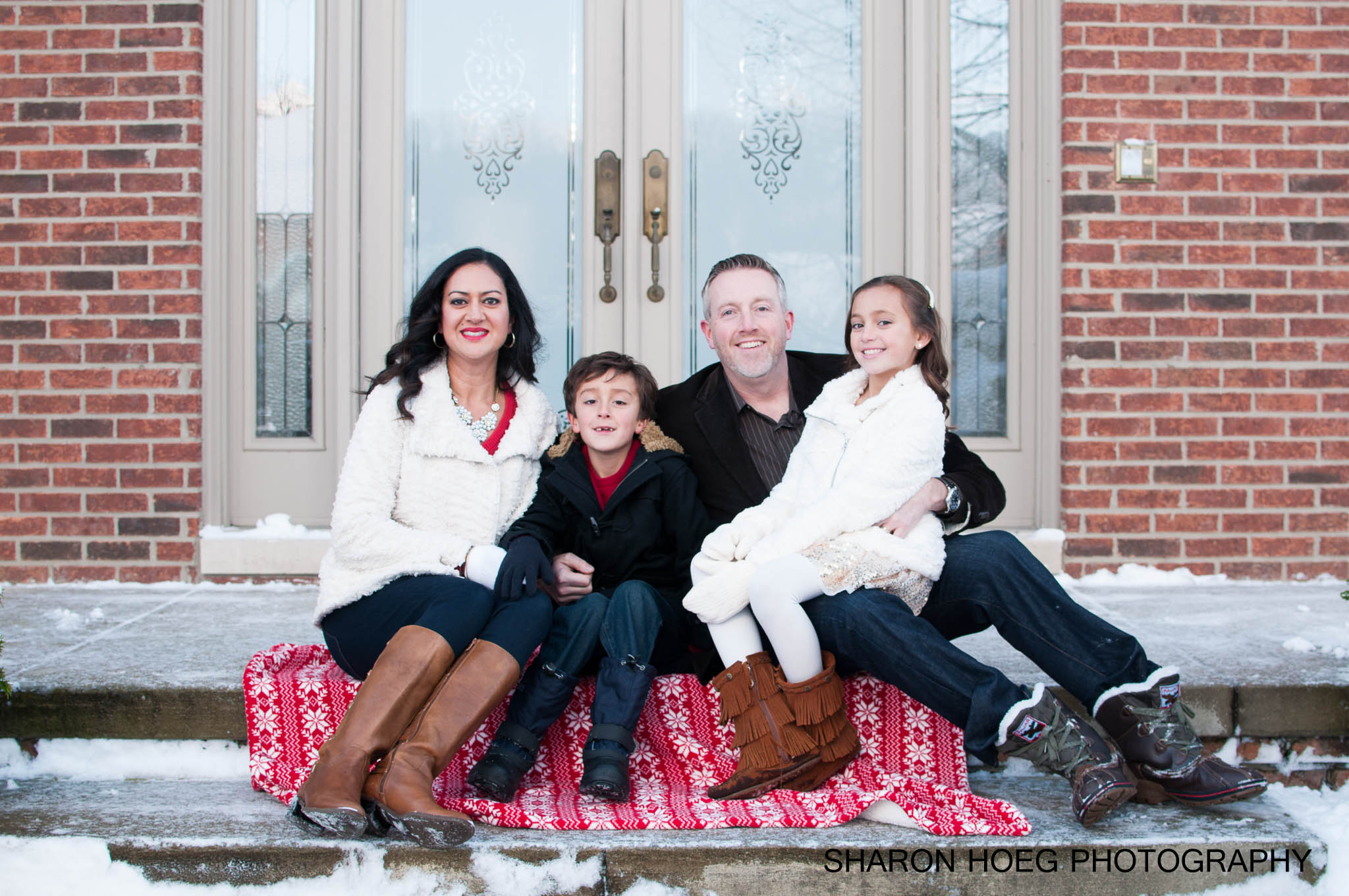 Family sitting on brick front porch, Northville Family Photographer