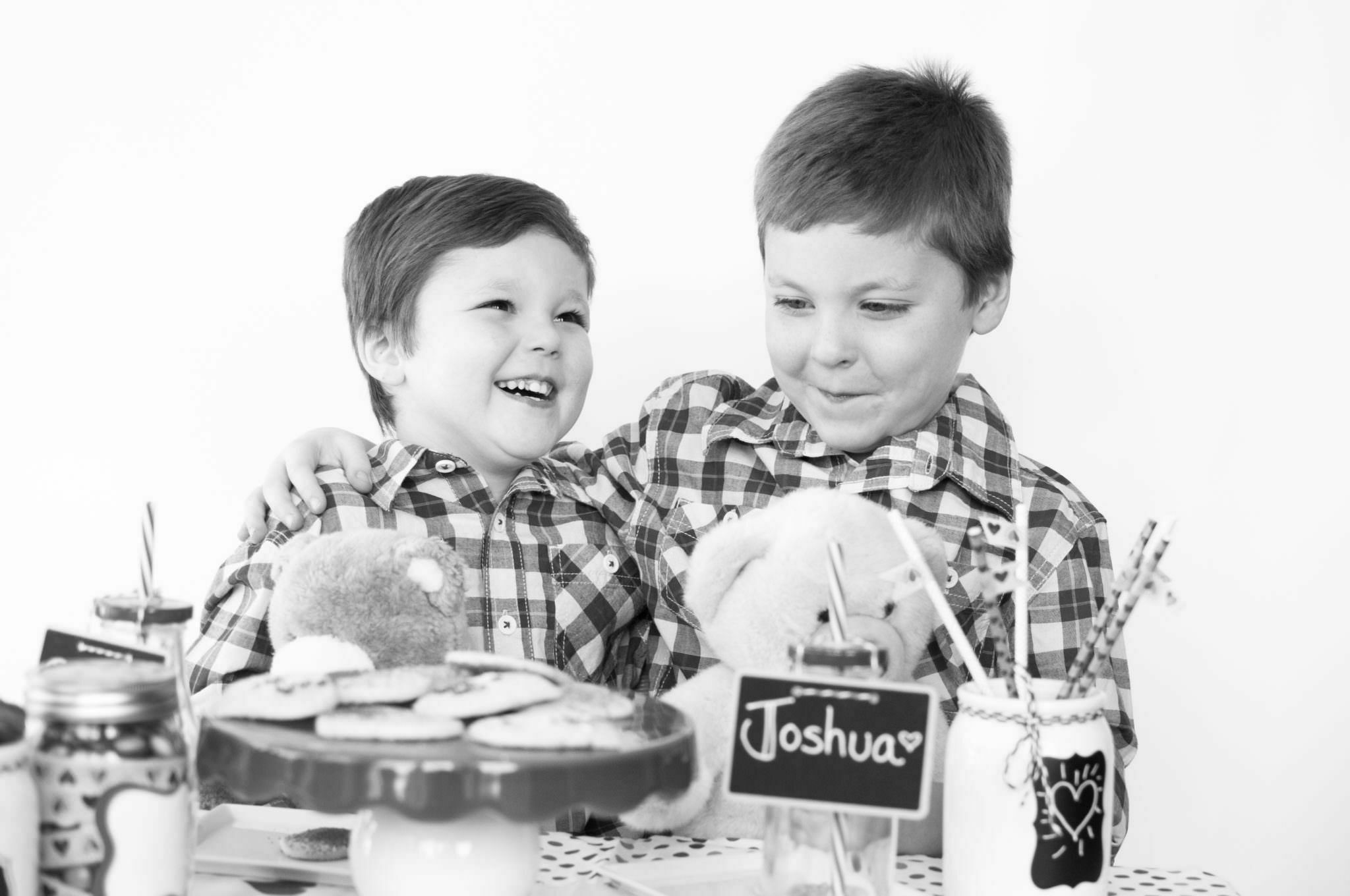 Brothers laughing at a party, Northville Child Photographer