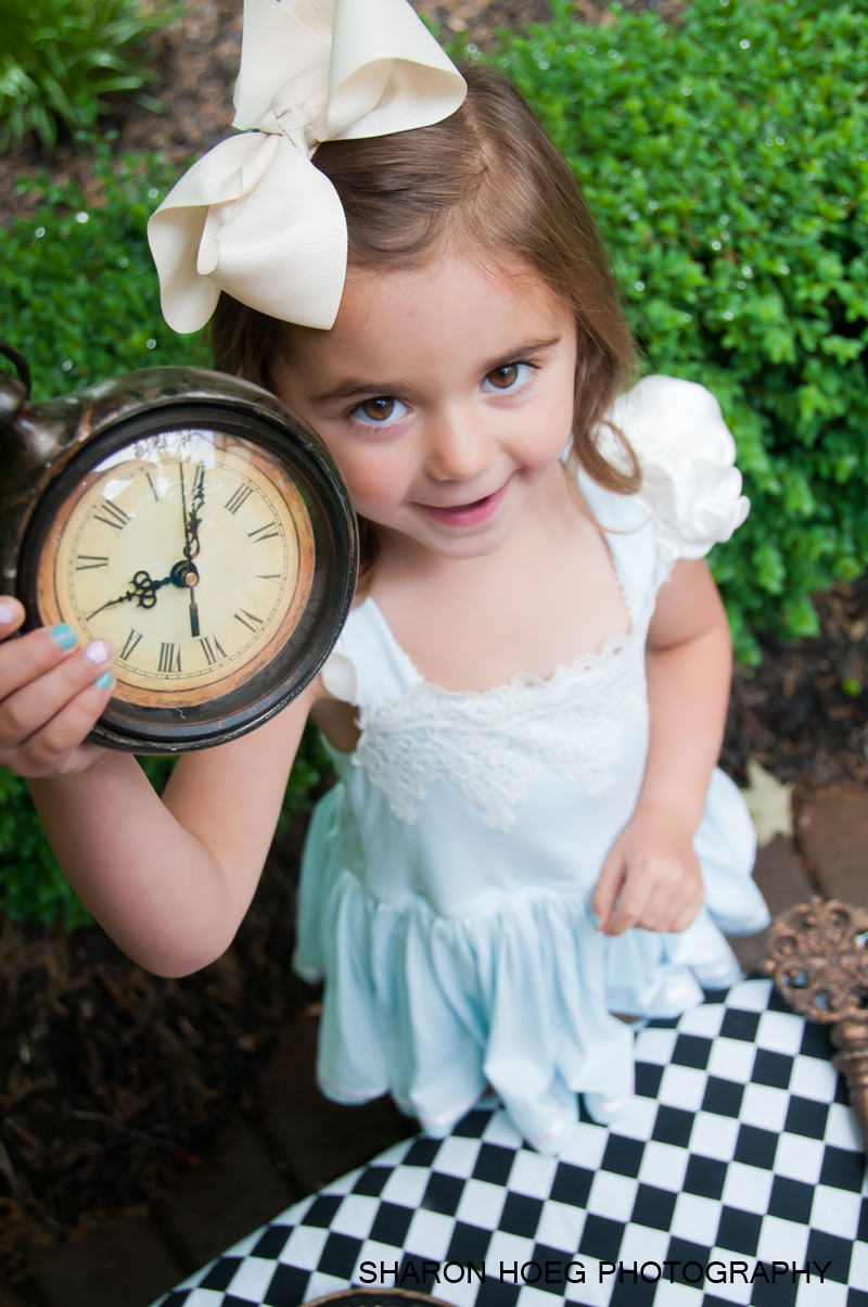 Girl dressed as Alice holding a clock, Metro Detroit Child Photographer