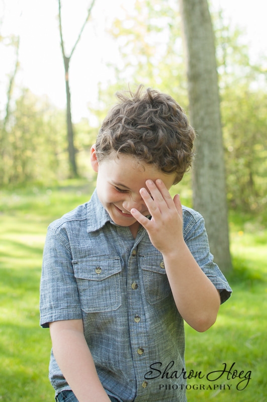 older boy laughing at a terrible joke, Livonia Child Photography