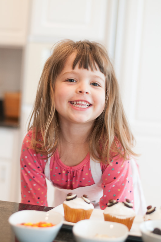 young girl smiling in the kitchen, Metro Detroit Child Photographer