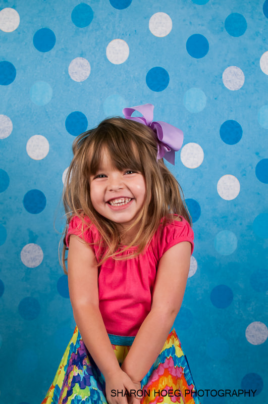 Smiling young blonde girl school portrait, Northville Child Photography