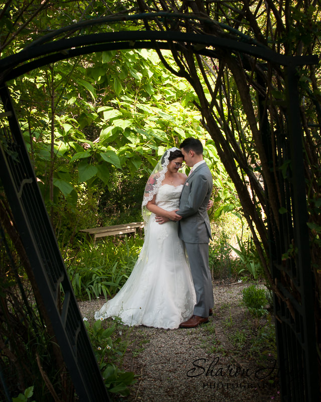 bride and groom sharing a moment in the garden, Greenmead Wedding Photographer