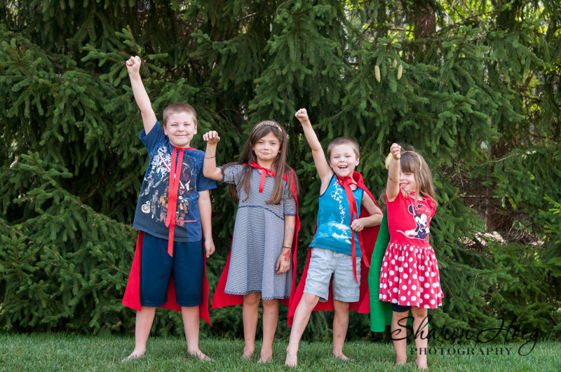 four kids in homemade super hero capes, felt projects for kids