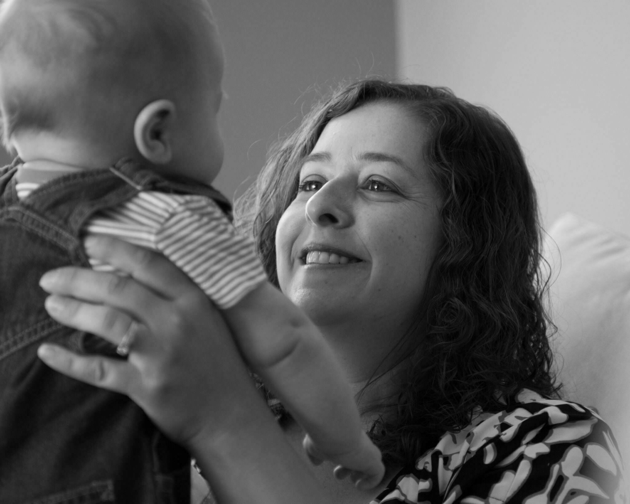 black and white of young baby with mom, South Lyon Family Photographer